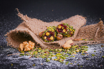 Turkish delight and pistachios on a black background