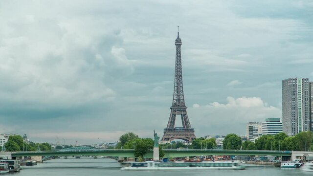 The Statue of Liberty and the Eiffel Tower Timelapse. View from Mirabeau bridge before sunset. Paris, France