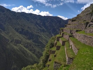 Fototapeta na wymiar Stairs - Machu Picchu - The lost city of the Inca in Peru, South America. Set high in the Andes Mountains, is a UNESCO World Heritage Site and one of the New Seven Wonders of the World.