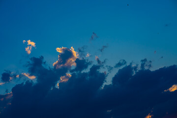 Fototapeta na wymiar Heavy cloudy sky at sunset. A landscape of beautiful nature