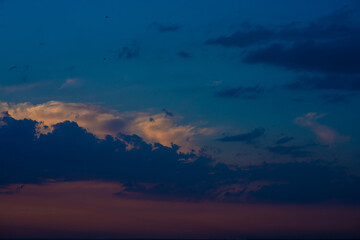 Heavy cloudy sky at sunset. A landscape of beautiful nature