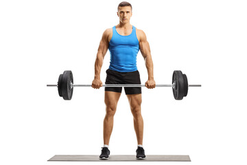 Full length portrait of a bodybuilder in sportswear lifting weights and looking at camera
