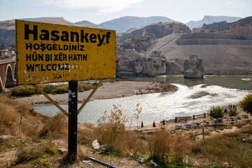 Hasankeyf sign on the road in mountains before the bridge get under the water