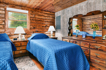 log cabin bedroom with lamps
