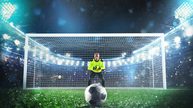 Soccer goalie ready to save a penalty kick at the stadium