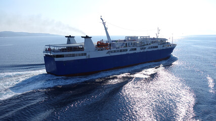 Passenger ferry reaching destination - busy port of Piraeus, Attica, Greece