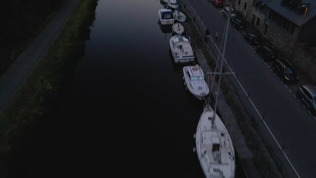 Aerial reveal Port of Dinan sunset 
