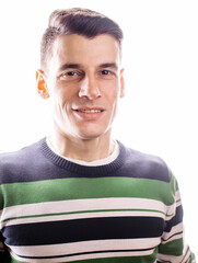 Portrait of a smart serious young man standing against white background. Emotional concept for gesture