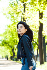 pretty young asian woman smiling cheerful in green park on summer sunny day, lifestyle people concept