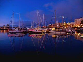 Fototapeta premium Inner Harbor in Victoria BC, Vancouver Island, Canada,decorated with festive lights during Christmas time