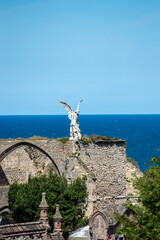 Statue of an angel at the cemetery of Comillas, Spain