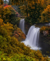 Waterfall Veliki Buk - Big Buk in green nature of Korana river, village of Rastoke, Slunj, Croatia. Autumn 2020. Long exposure picture.