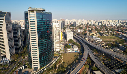 Fototapeta na wymiar Aerial view of Jornalista Roberto Marinho avenue, near Ponte Estaiada (Estaiada bridge), in Sao Paulo city, Brazil.