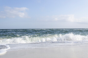 blue sea water waves on sandy beach with panoramic horizon summer holiday travel relax recreation concept 