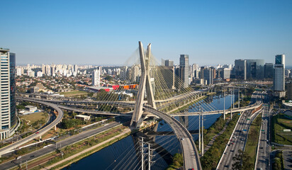 Fototapeta na wymiar EstaiaCable-stayed bridge or Estaiada bridge (Ponte Estaiada), over the Pinheiros river and Marginal Pinheiros, at Sao Paulo city. Brazil.