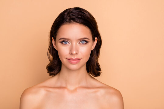 Close up photo beautiful amazing she her lady blue eyes healthy brown curls ideal brilliant appearance plump allure tempting big lips balm wear no clothes isolated beige pastel background