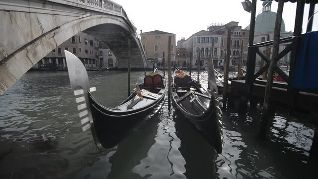 Gondolas parked near Rialto bridge in Venice. Venice without tourists