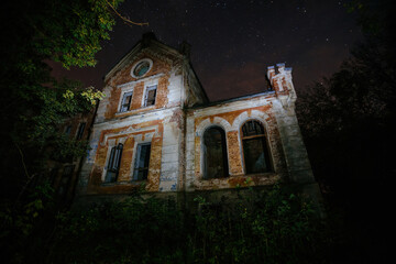 Dark and creepy old abandoned haunted mansion at night. Former Karl von Meck house