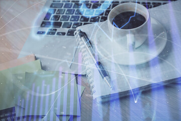Double exposure of forex chart drawing and desktop with coffee and items on table background. Concept of financial market trading