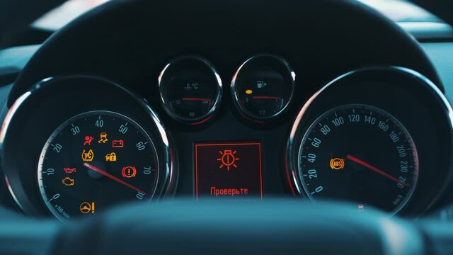 The car dashboard lights up when engine starts