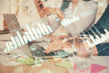 Multi exposure of woman hands typing on computer and forex chart hologram drawing. Stock market analysis concept.