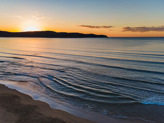 Aerial Sunrise Seascape over Umina Beach on the Central Coast of NSW, Australia.
