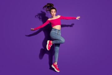 Fototapeta na wymiar Full length body size view of lovely funky cheery girl having fun jumping pout lips having fun isolated bright violet color background