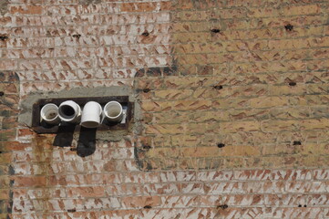 Drains on a wall