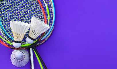 Badminton rackets and badminton shuttlecocks feather balls.
