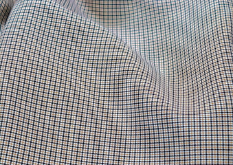 Detailed close up view on samples of cloth and fabrics in different colors found at a fabrics market