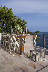 White and Gold Romantic Wedding Table Top Layout Table Spread no people no human tropical location with gold cutlery and scenic view tablescape