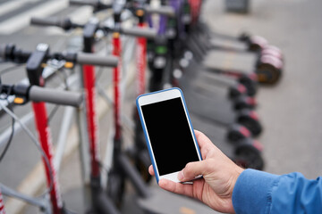Electric scooter rental via smartphone app with help of QR code.