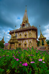 Naklejka premium The background of religious attractions in Phuket (Chalong Temple) has beautiful churches, always frequented by foreign tourists and Thai people to make merit.