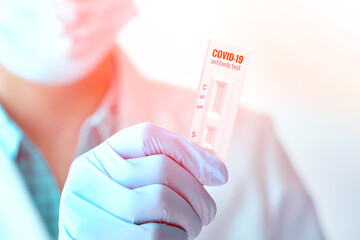 Medic shows rapid laboratory COVID-19 test for detection of antibodies to Novel Coronavirus