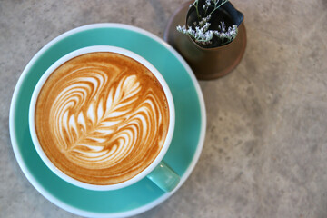 cup of hot latte art coffee