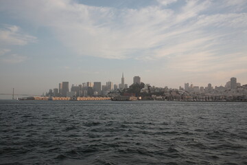 Fototapeta na wymiar View of San Francisco skyline from Alcatraz Island under sunset in San Francisco, California, USA.