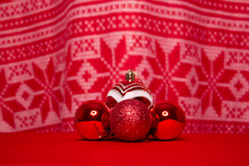 New year's red balls on the background of a new year's ornament