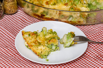 Baked broccoli baked with cheese on plate