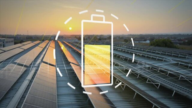 Large field of solar panels collects energy from the setting sun and charges digital battery symbol. Eco-friendly turn to renewable energies. Clean power from solar farms.