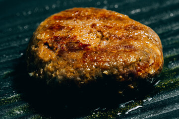 Hamburg meat grilling in a pan One of the main ingredients of a hamburger.