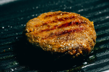 Hamburg meat grilling in a pan One of the main ingredients of a hamburger.
