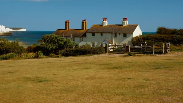 Stunning scenery at Cuckmere Haven, Sussex, England, with the Coastguard Cottages and the famous chalk cliffs, the Seven Sisters