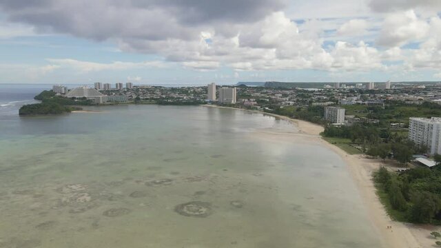 Drone flying over downtown Tumon and Tamuning on the tropical island of Guam