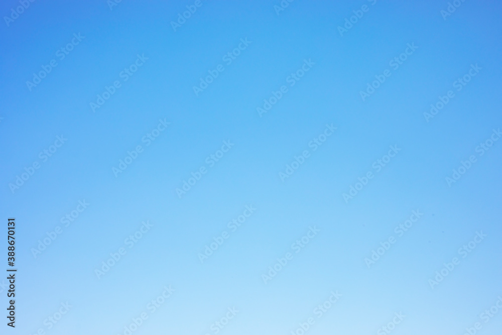 Wall mural clear blue sky background and empty space for your design, no cloud