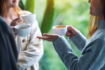 Close up image of people enjoyed talking and drinking coffee together