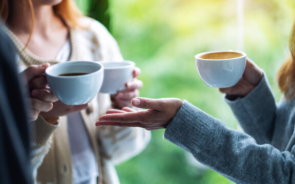 Close up image of people enjoyed talking and drinking coffee together