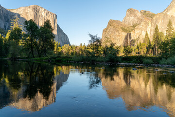 el capitan and bridal veil falls reflected in the merced river on an autumn evening at yosemite national park in california