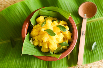 Cooked tapioca or Cassava root , Mandioca or Aipim, Kerala special Kappa Puzhukku or Kappa biryani South Indian food with spicy meat curry, beef tapioca, India. with Fish curry. root vegetable Brazil