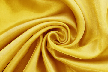Gold fabric texture background, detail of silk or linen pattern.