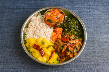 Cooked tapioca and spicy meat curry , Fish curry , Cassava root , Mandioca or Aipim,  Kerala special Kappa Puzhukku or Kappa biryani South Indian food  beef tapioca, India. root vegetable Brazil